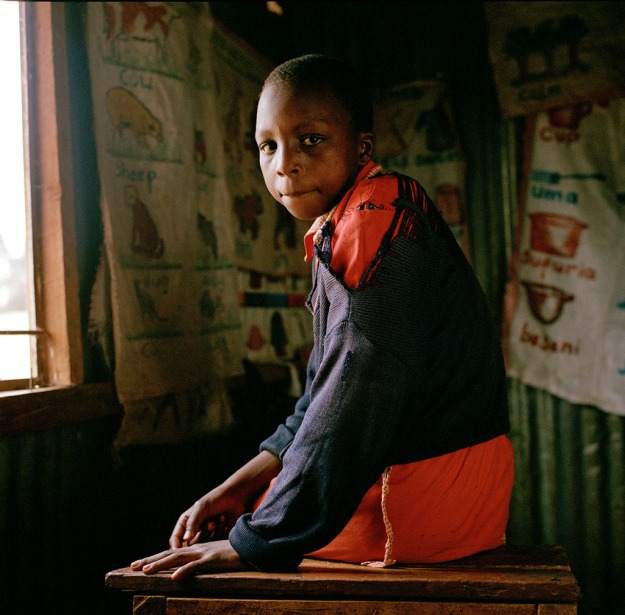 Lucy Wambui (13 ) photographed in one of the classrooms at Attnas Kandie School.